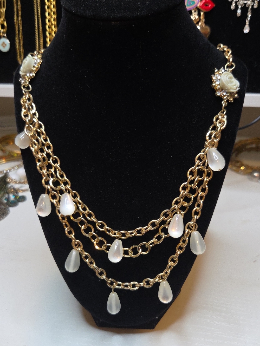 Gold Multi-Strand Necklace with White Teardrop Pendants
